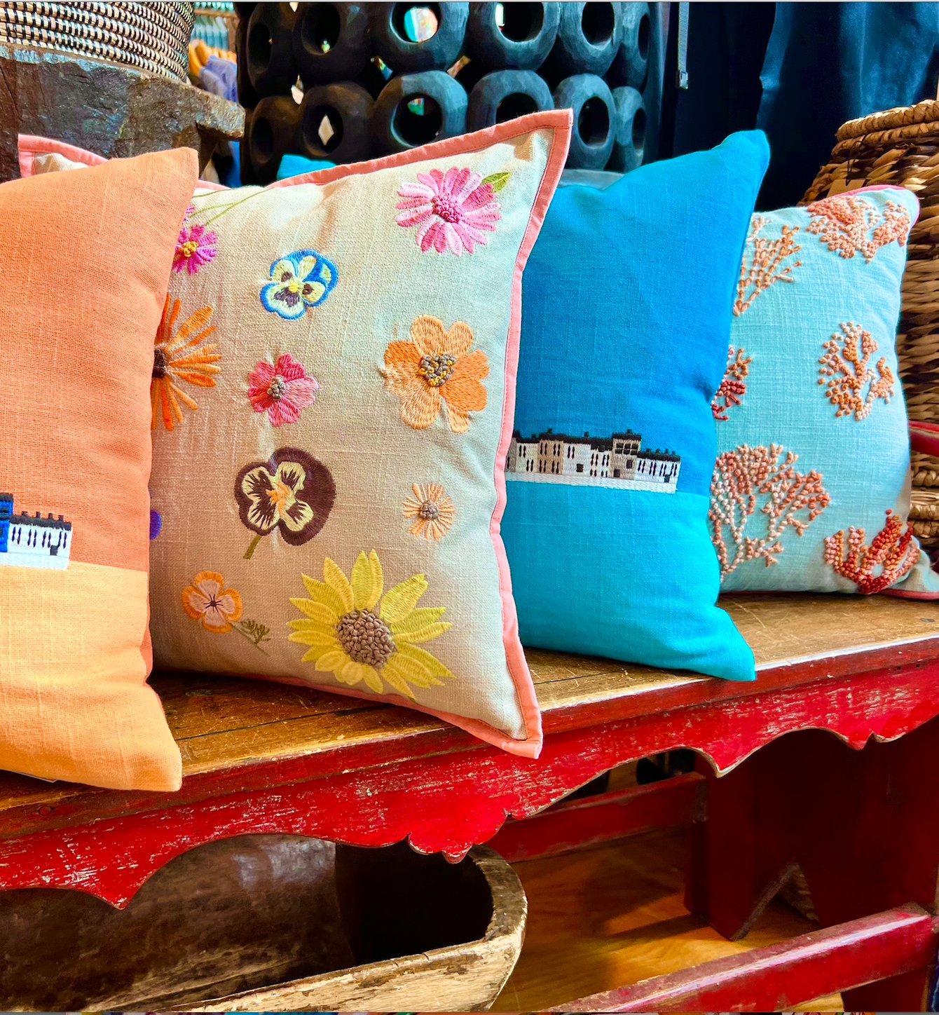 4 Vibrantly Colored Pillows that were hand knotted in India and made with 100% Cotton